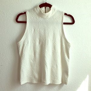 White sleeveless turtle neck anthro top